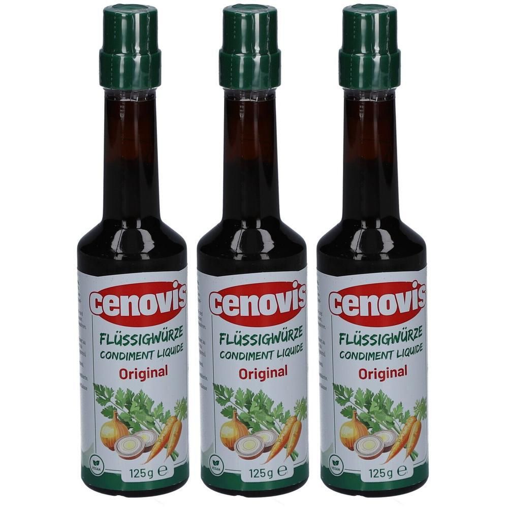 Drei Flaschen Flüssigwürze. Jede Flasche hat einen grünen Deckel und ein weißes Etikett mit Produktnamen und Gemüseabbildung.