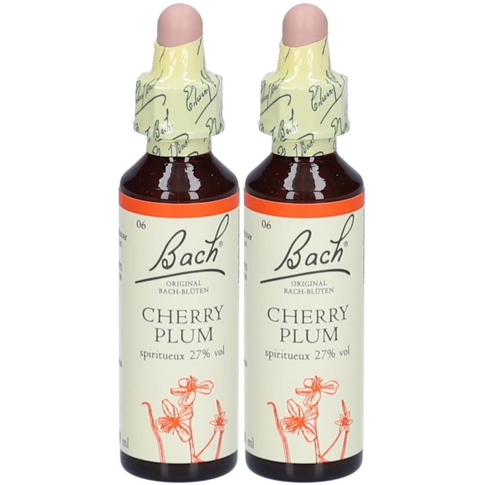 Zwei Flaschen mit brauner Flüssigkeit. Aufschrift: Bach Original, Cherry Plum, spiritueux 27% vol. Mit rosa Verschluss und gelbem Papier.