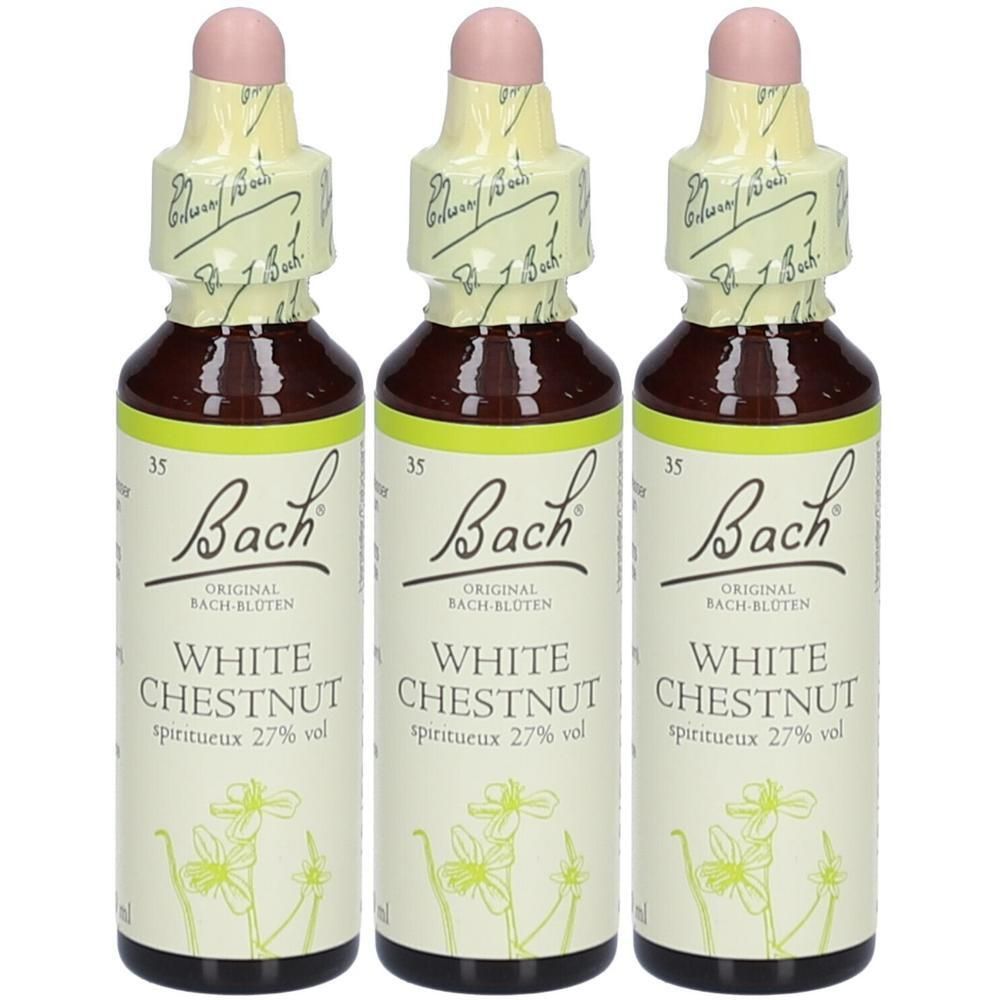 Drei Flaschen mit braunem Glas, weißem Etikett und rosa Verschluss. Aufschrift: Bach Original White Chestnut, spiritueux 27% vol.