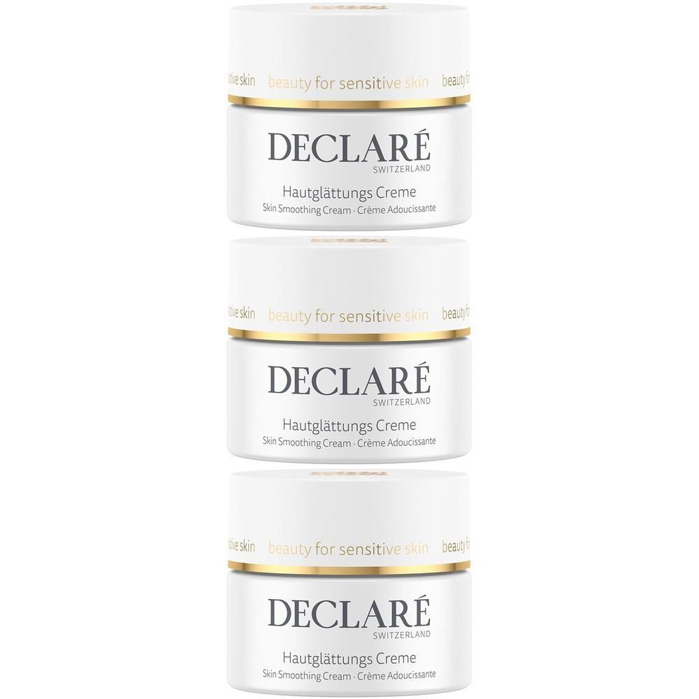 Trois pots de crème blancs avec couvercles dorés. Inscription DECLARE, Crème lissante. Produit suisse.
