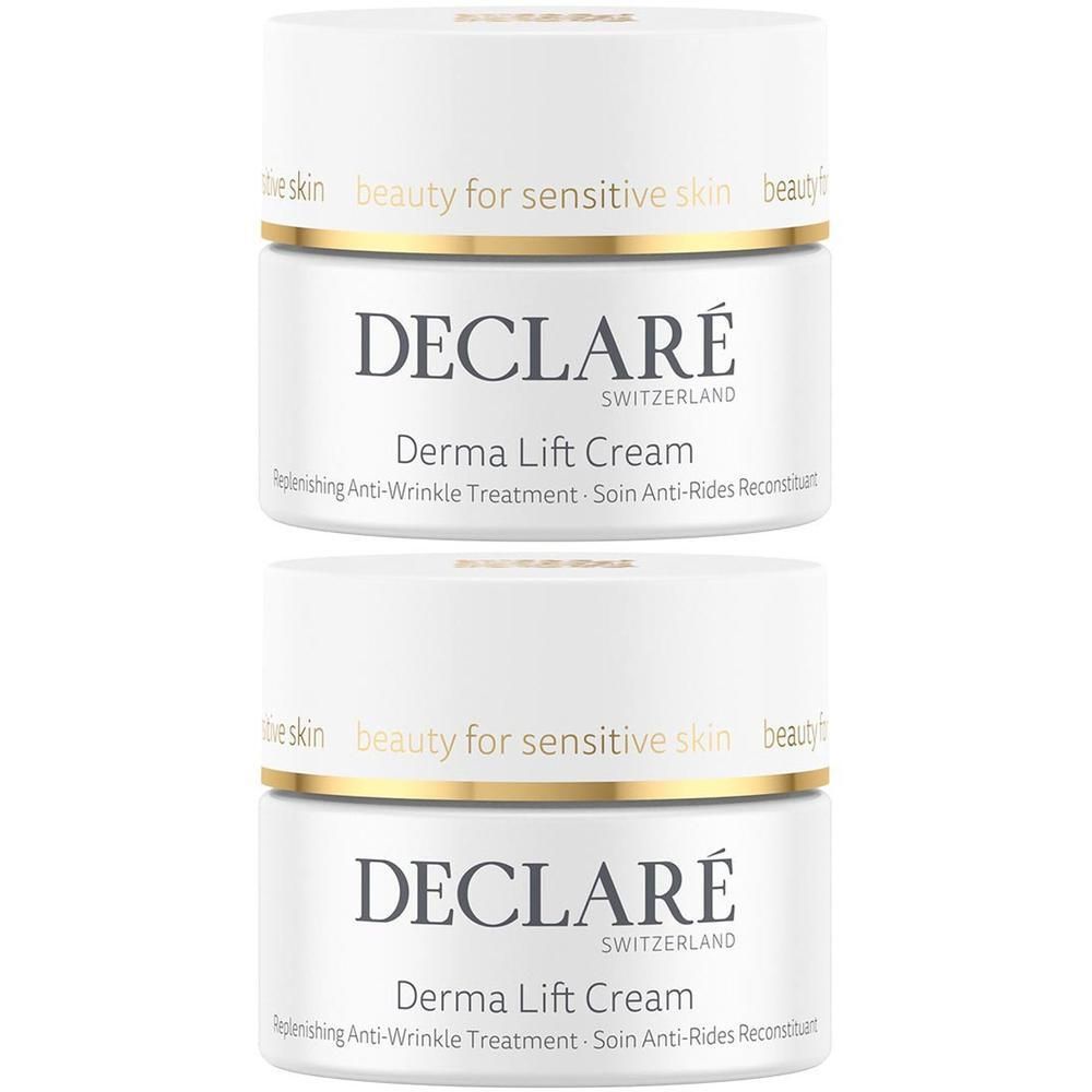 Zwei weiße Tiegel Declare Derma Lift Creme mit goldenem Rand.