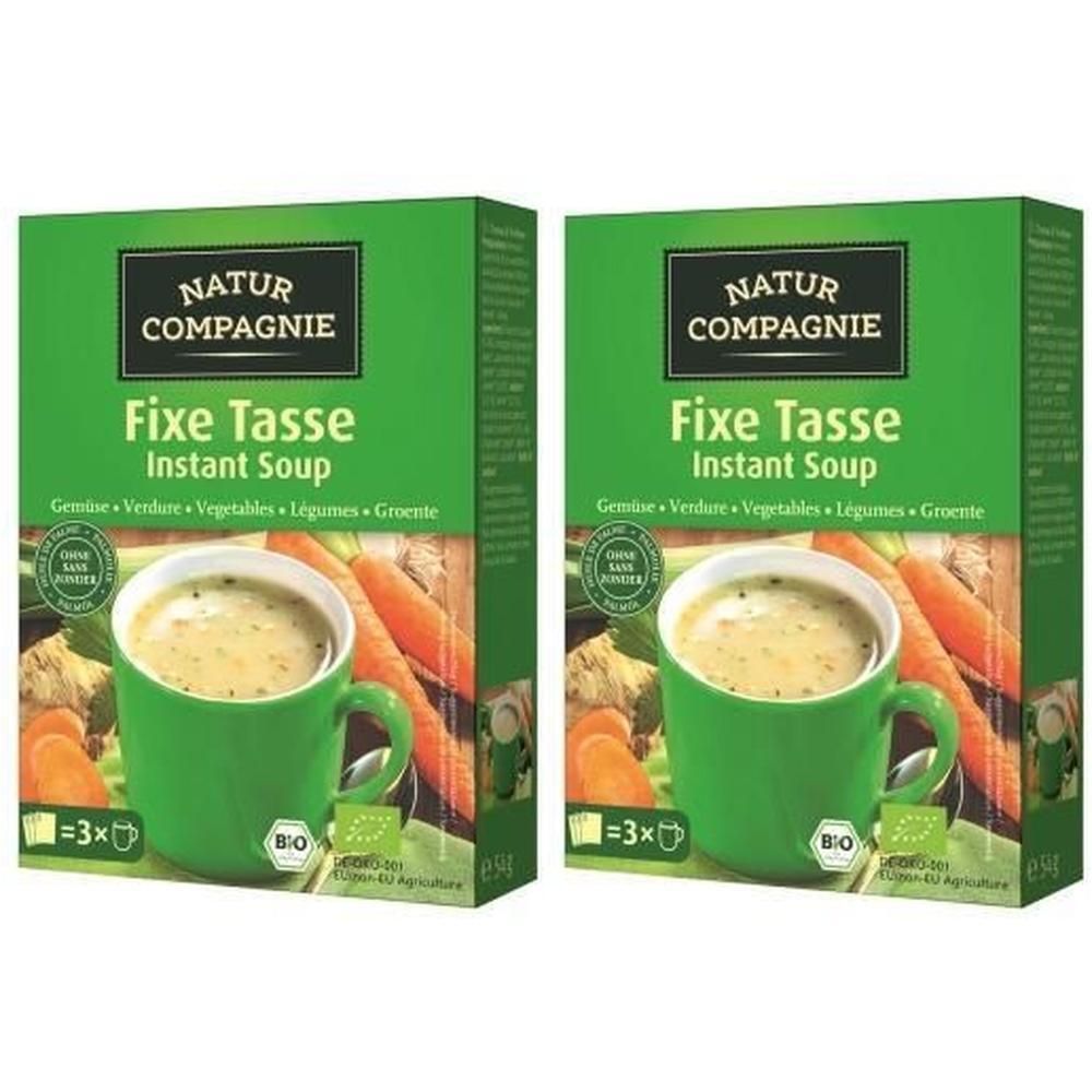 Zwei grüne Kartons mit "NATUR COMPAGNIE" und "Fixe Tasse Instant Soup" Aufdruck. Bio-Siegel. Abbildung einer Tasse Suppe mit Gemüse.