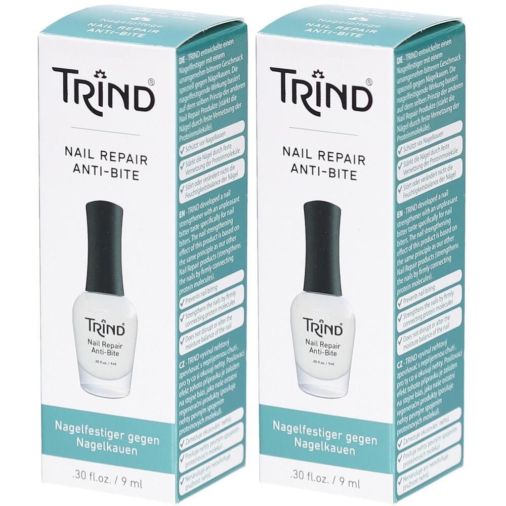 Zwei Packungen Nagellack. Auf der Verpackung steht "TRIND Nail Repair Anti-Bite". Flaschen mit schwarzem Deckel und weißem Inhalt.