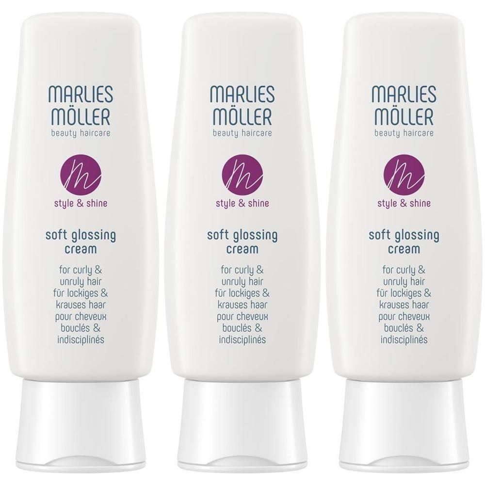 Drei weiße Tuben mit lila Logo und Schriftzug. Aufschrift: Soft Glossing Cream. Für lockiges und krauses Haar.