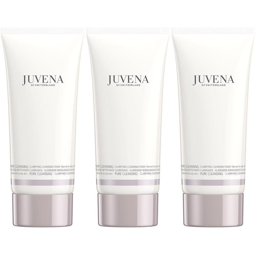 Drei weiße Tuben Juvena Clarifying Cleansing Foam mit silbernem Deckel und Band.