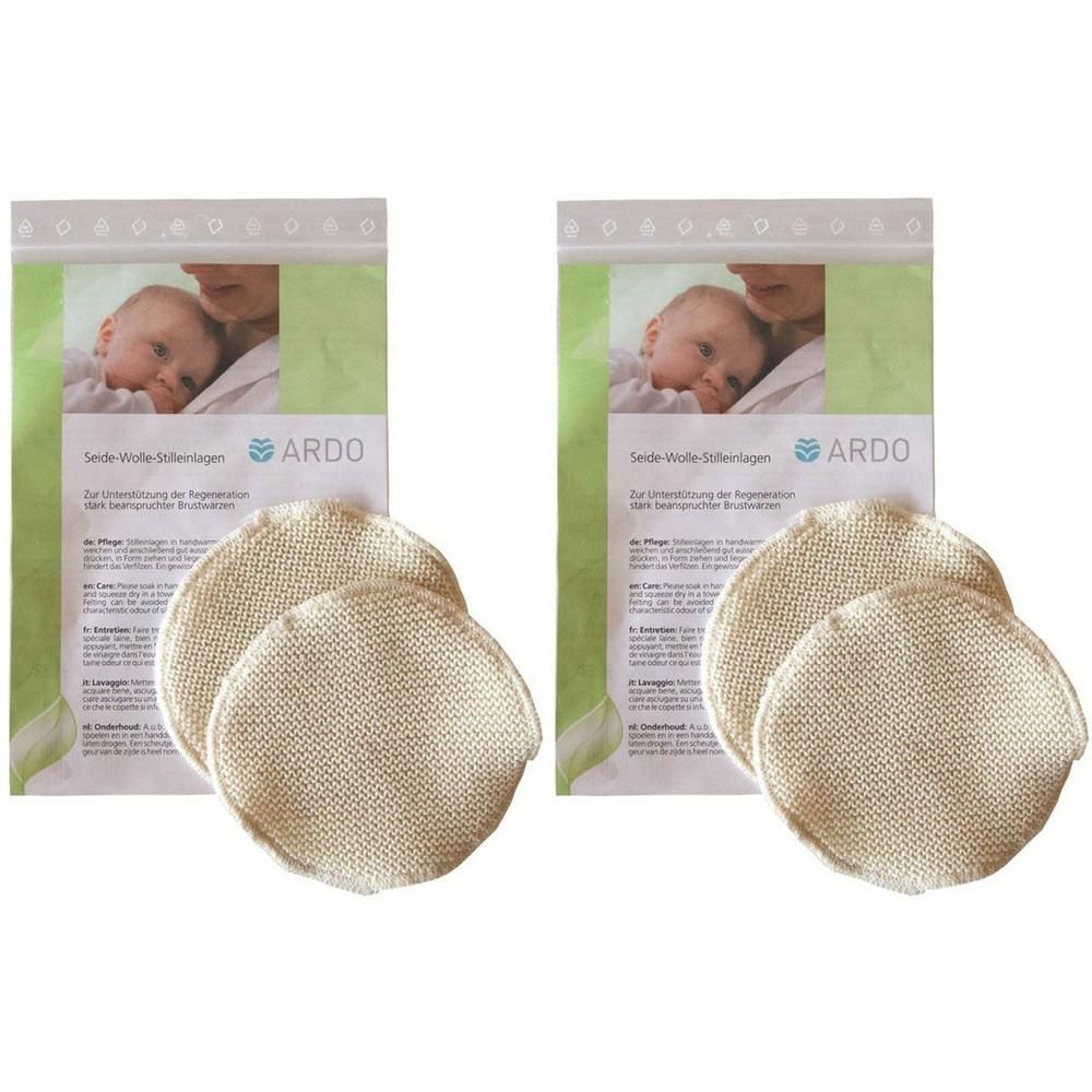 Zwei Packungen mit ARDO Stilleinlagen aus Seide/Wolle. Jede Packung zeigt zwei runde, beige Einlagen und ein Baby-Motiv.