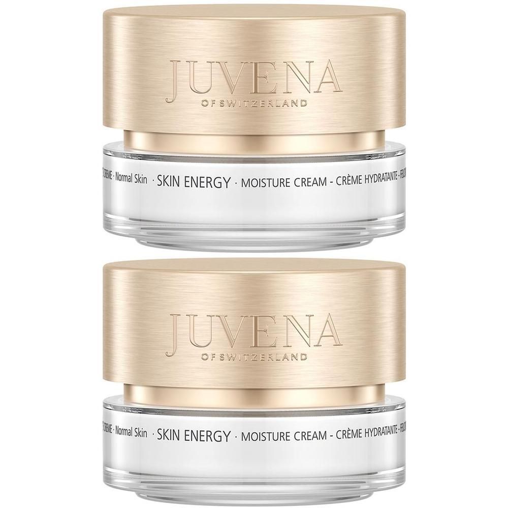 Deux pots de crème avec couvercles dorés. Inscription: JUVENA. En dessous: SKIN ENERGY MOISTURE CREAM.