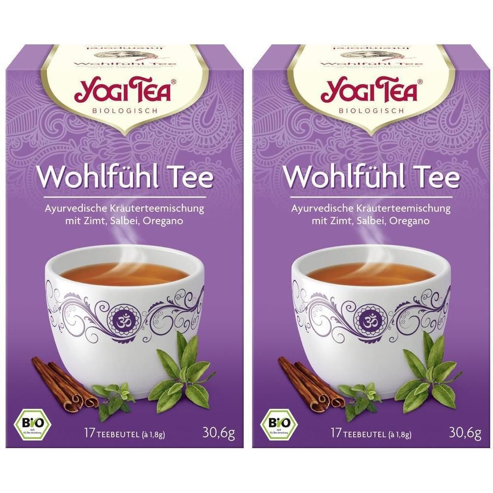 Zwei Packungen Yogi Tee Wohlfühl Tee. Lila Verpackung mit Tasse Tee, Zimt, Kräutern. Text: Yogi Tea, Bio, 17 Teebeutel.