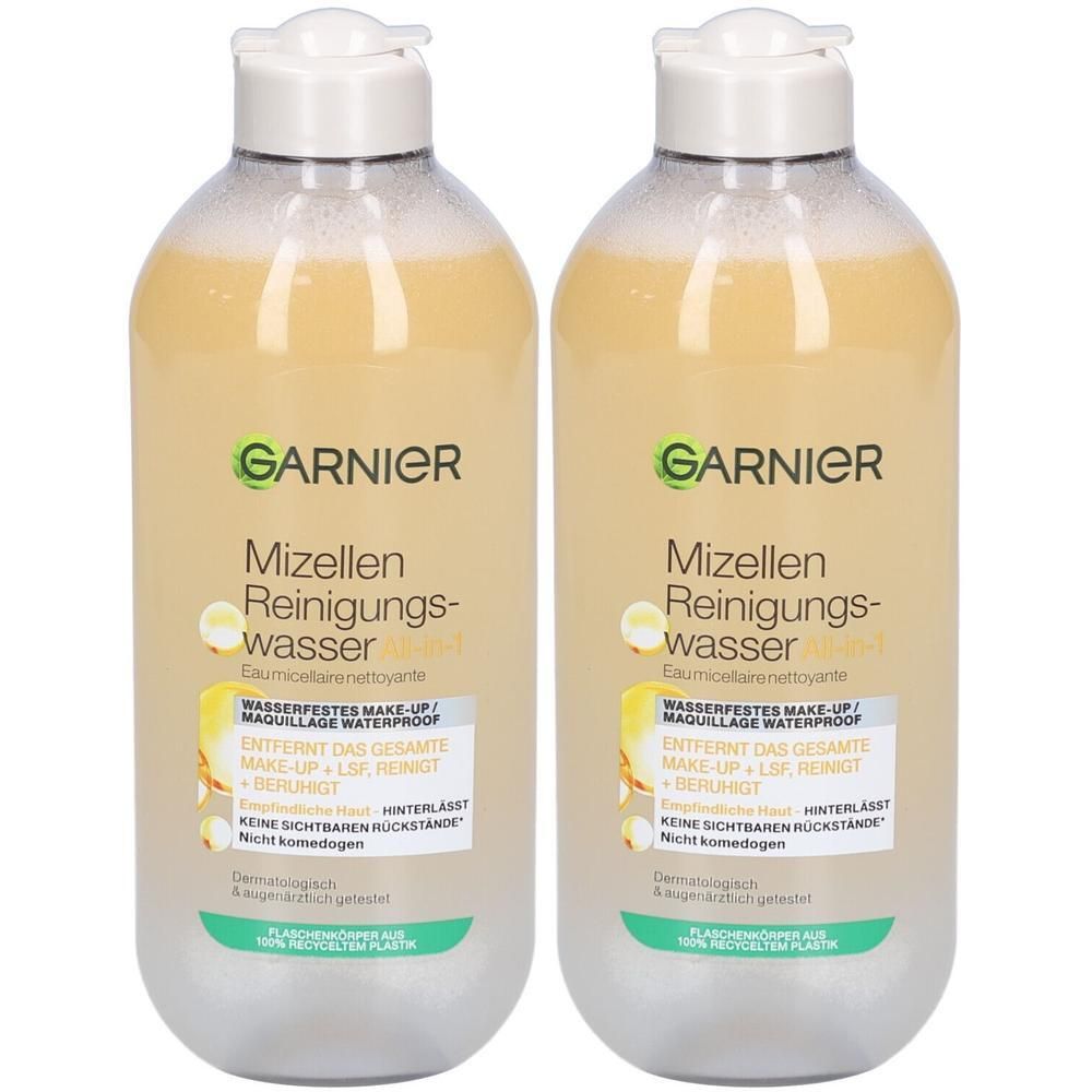 Deux bouteilles de Garnier Mizellen Reinigungswasser avec liquide jaunâtre et bouchon blanc.