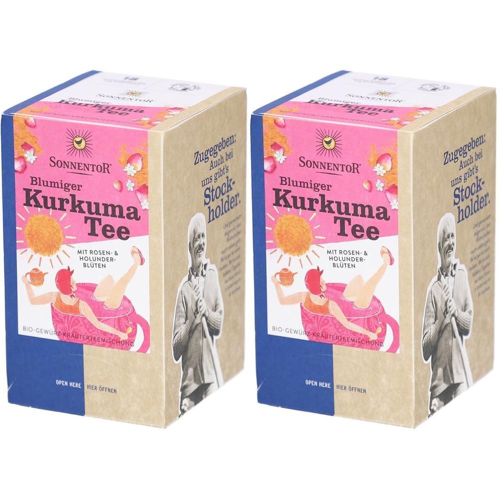 Zwei Kartons Tee. Aufdruck: SONNENTOR Blumiger Kurkuma Tee. Rosa, gelb und braun. Mit Illustration einer Frau in einer Tasse.