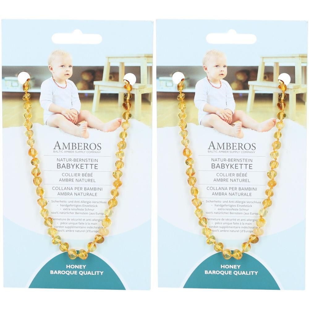 Bernsteinkette für Babys, Honey, Barock-Qualität. Verpackung mit Produktnamen und Baby-Foto. Kette aus honigfarbenen Perlen.