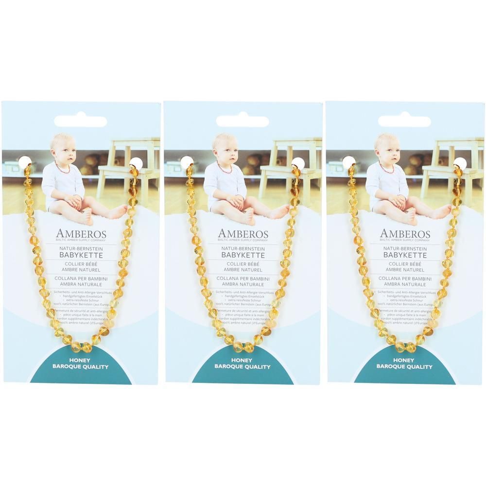 Drei Babyketten auf Verpackungen. Jede Kette hat honigfarbene Bernsteine. Auf den Verpackungen steht AMBEROS BABY KETTE.