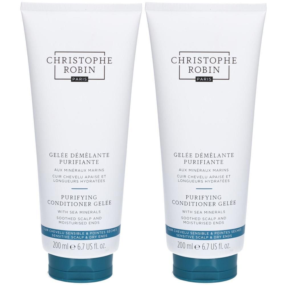 Deux tubes blancs avec bouchon bleu. Inscription: CHRISTOPHE ROBIN PARIS, GELEE DÉMÊLANTE PURIFIANTE, PURIFYING CONDITIONER GELÉE.