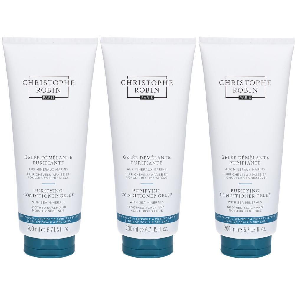 Trois tubes blancs avec bouchon bleu. Inscription: CHRISTOPHE ROBIN, GELÉE DÉMÊLANTE PURIFIANTE, PURIFYING CONDITIONER GELÉE.