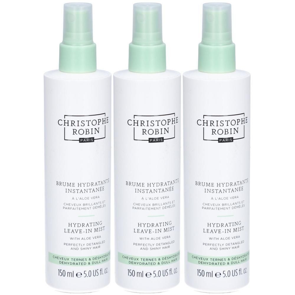 Trois flacons vaporisateurs blancs avec bouchons verts. Inscription: CHRISTOPHE ROBIN PARIS, BRUME HYDRATANTE INSTANTANEE, HYDRATING LEAVE-IN MIST.