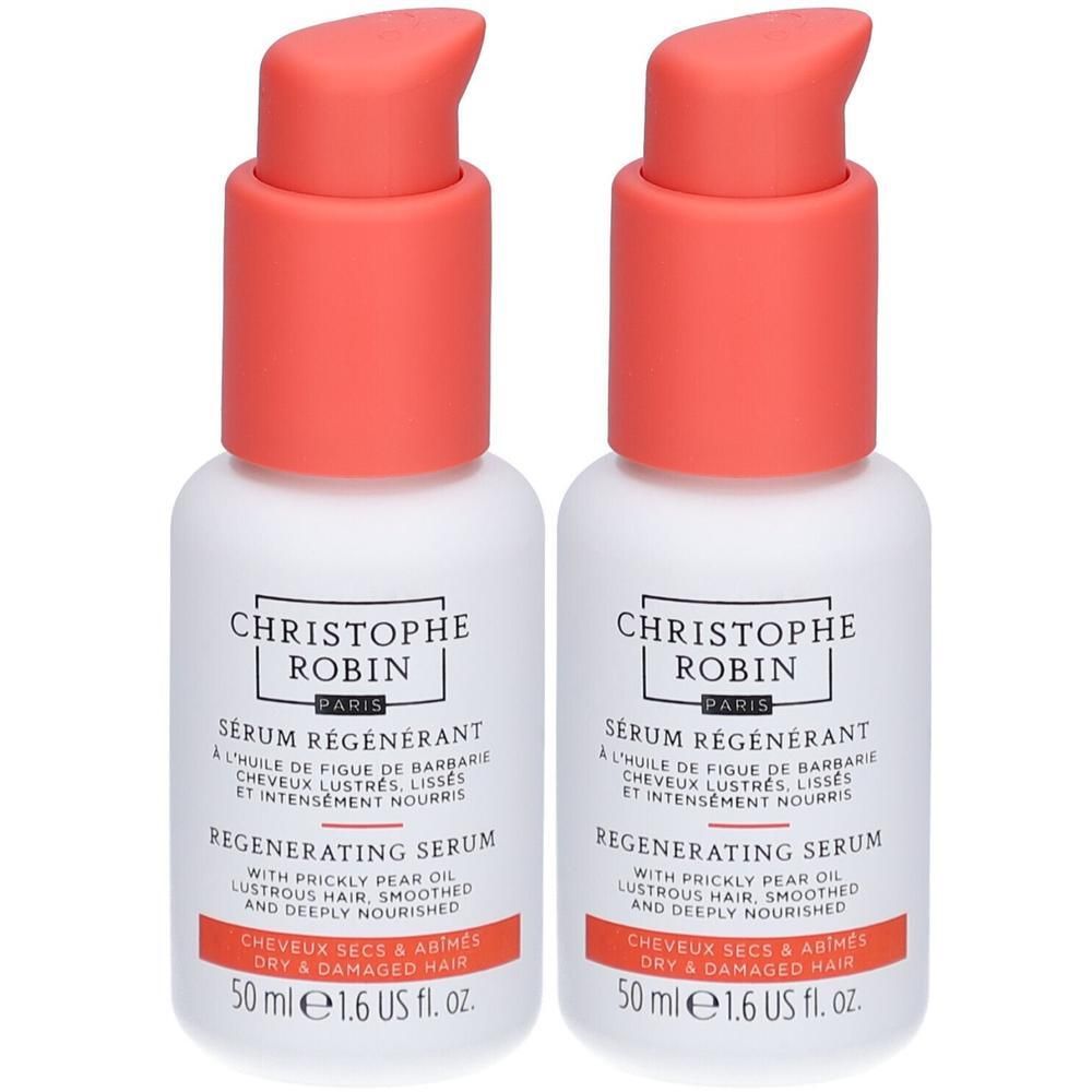 Zwei weiße Flaschen mit korallenfarbenen Pumpköpfen. Aufschrift: CHRISTOPHE ROBIN, Sérum Régénérant, Regenerating Serum, 50 ml.