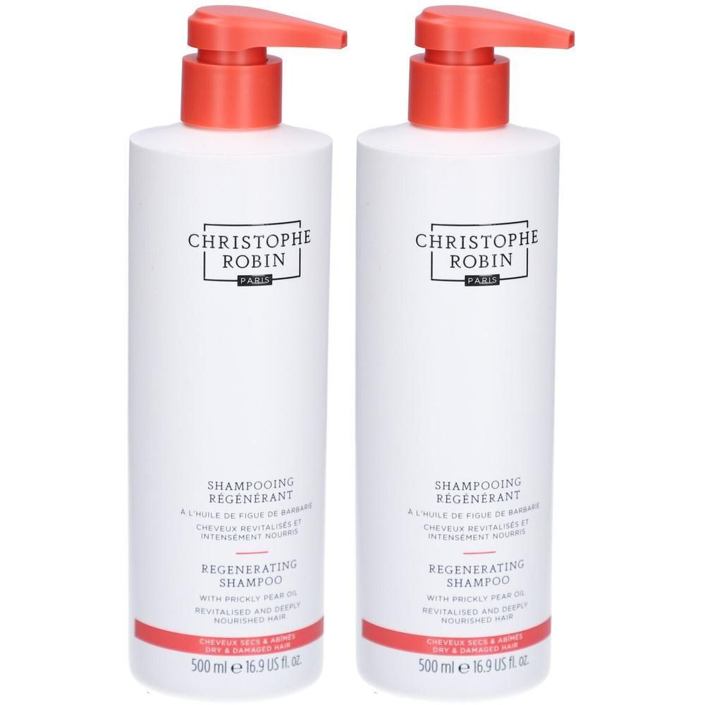 Zwei weiße Flaschen mit rotem Pumpkopf. Aufschrift: CHRISTOPHE ROBIN PARIS, SHAMPOOING REGENERANT, REGENERATING SHAMPOO. 500 ml.