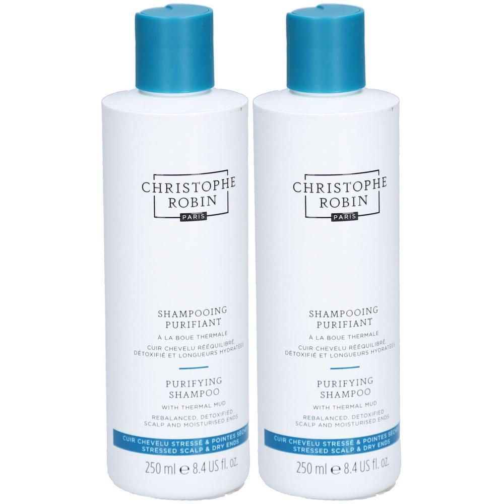 Zwei weiße Flaschen mit blauem Deckel. Aufschrift: CHRISTOPHE ROBIN, SHAMPOOING PURIFIANT, PURIFYING SHAMPOO. Text: 250 ml, 8.4 US fl oz.