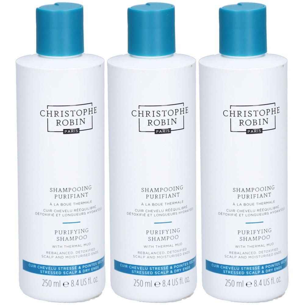 Drei weiße Flaschen mit blauem Deckel. Aufschrift: CHRISTOPHE ROBIN PARIS, SHAMPOOING PURIFIANT, PURIFYING SHAMPOO. 250 ml.