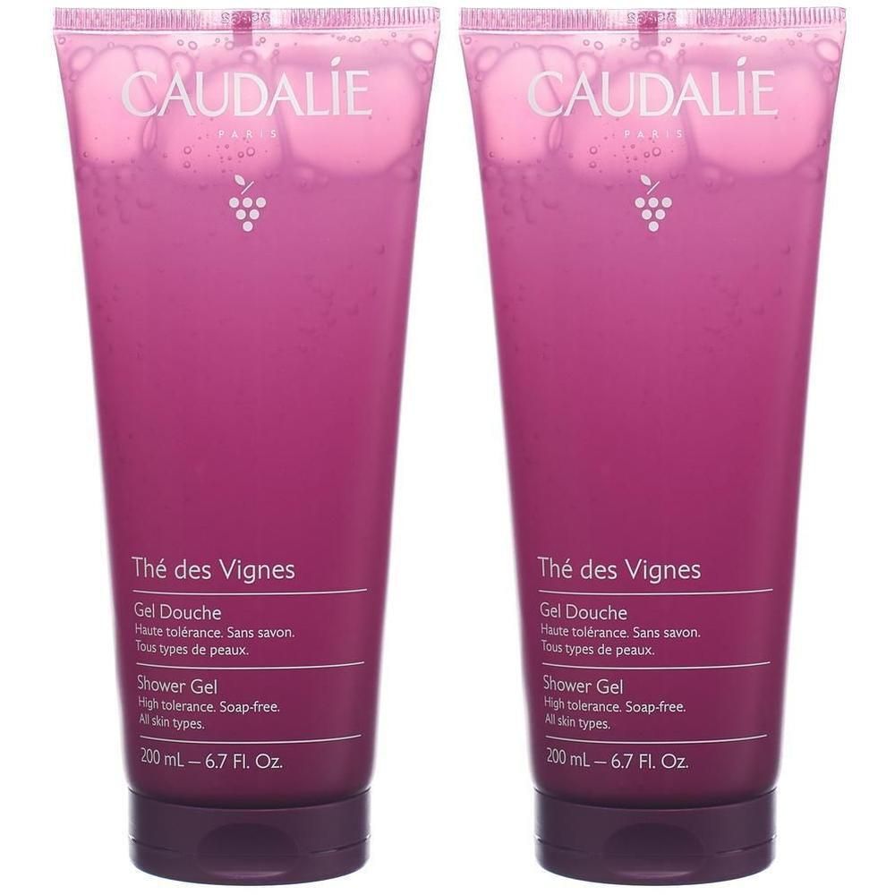 Zwei Tuben Duschgel. Aufschrift CAUDALIE, Thé des Vignes, Gel Douche. Rosa Flüssigkeit in dunkelroten Tuben mit Schraubverschluss.