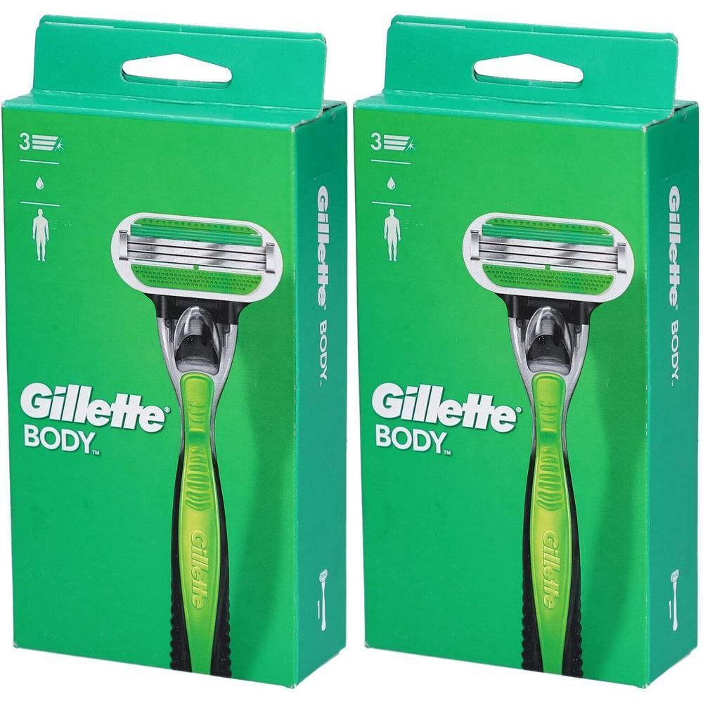 Zwei grüne Verpackungen mit Rasierern. Aufschrift Gillette BODY. Rasierer mit grünem Griff und drei Klingen. Verpackung mit Griffloch.