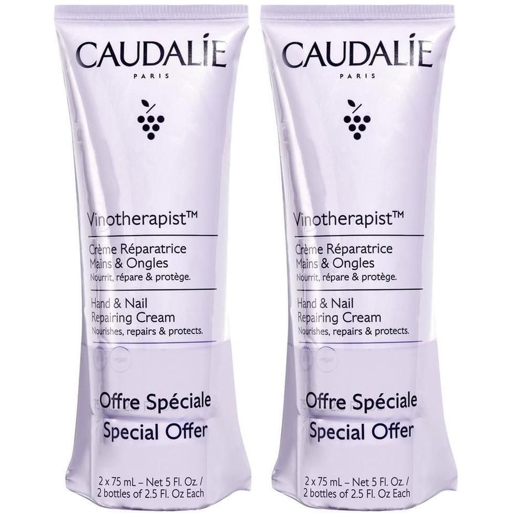 Zwei Tuben Hand- und Nagelreparaturcreme. Aufschrift: CAUDALIE PARIS, Vinotherapist, Crème Réparatrice Mains & Ongles. Sonderangebot.