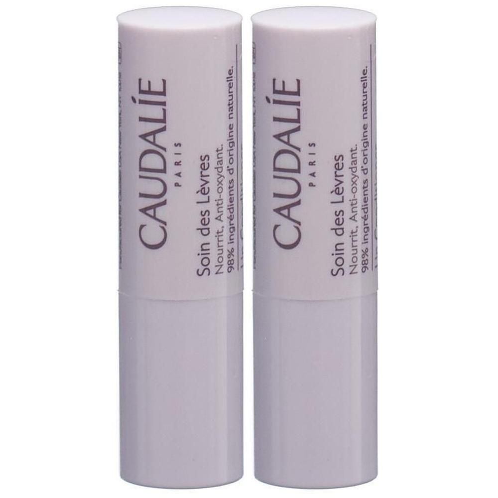 Zwei weiße Lippenpflegestifte. Aufschrift: CAUDALIE PARIS, Soin des Lèvres, 98% Inhaltsstoffe natürlichen Ursprungs.