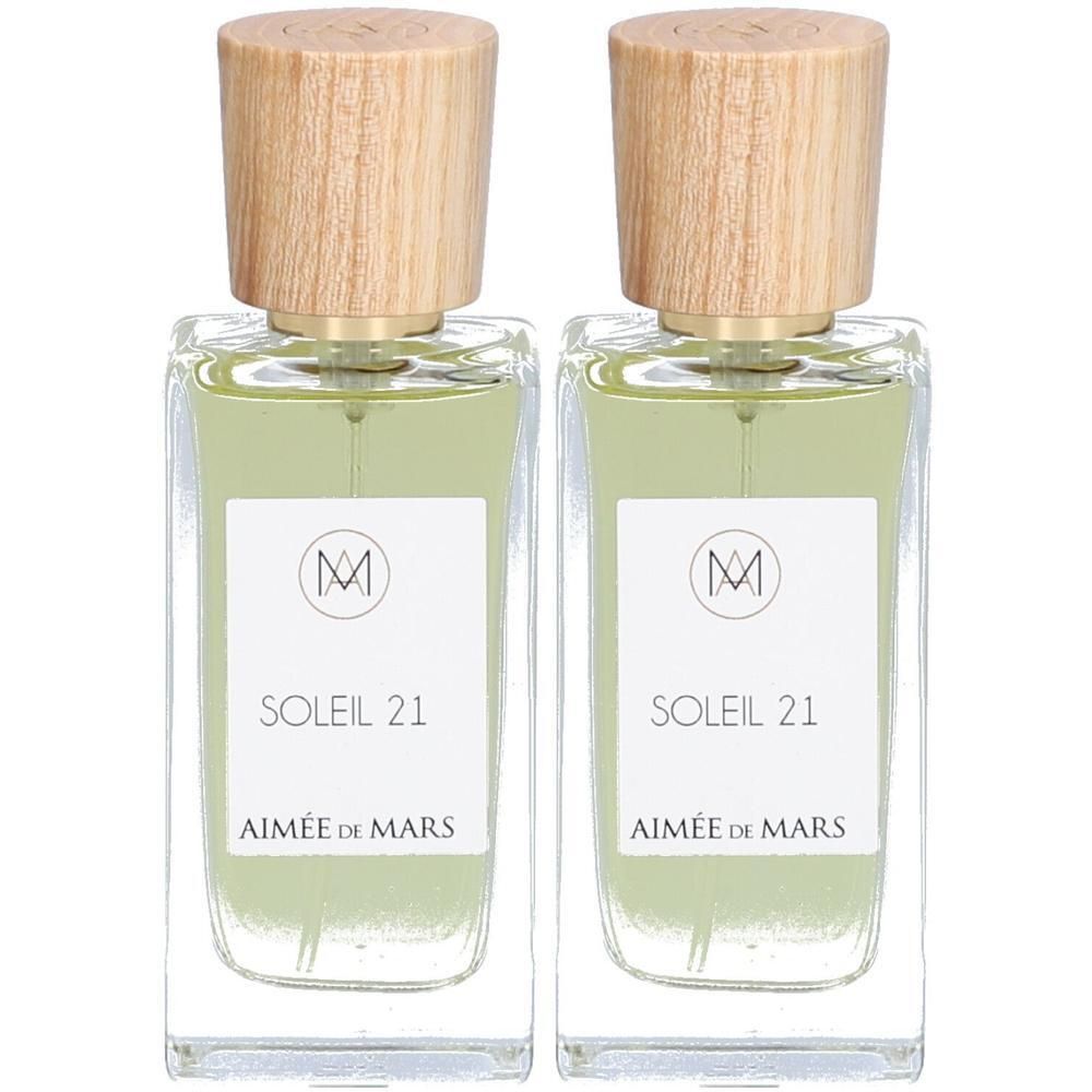 Deux flacons de parfum rectangulaires avec bouchons en bois. Étiquettes: Soleil 21, Aimée de Mars. Symbole de certification.