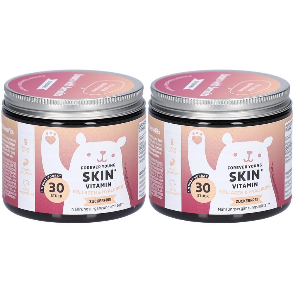 Zwei Dosen Forever Young Skin Vitamin. Aufschrift: Skin Vitamin, 30 Stück, zuckerfrei. Rosa Deckel, silberner Rand, Bär-Illustration.
