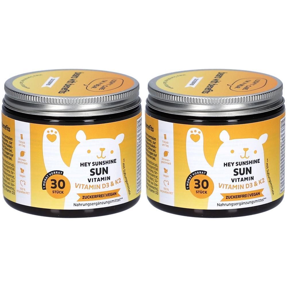 Deux boîtes de Hey Sunshine Sun Vitamin. Étiquettes jaunes avec un ours blanc. Contient de la vitamine D3 & K2, sans sucre, 30 pièces.