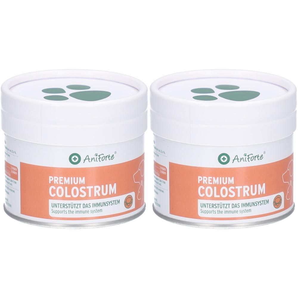 Zwei weiße Dosen mit Deckel. Aufschrift: Premium Colostrum. Marke: Aniforte. Unterstützt das Immunsystem. Grünes Logo mit Pfoten.