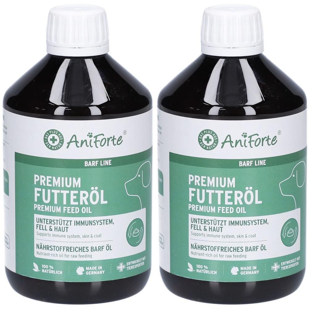 Deux bouteilles d'huile alimentaire AniForte Premium. Étiquettes vertes avec informations produit. Bouchons blancs. Soutient le système immunitaire, peau et pelage.