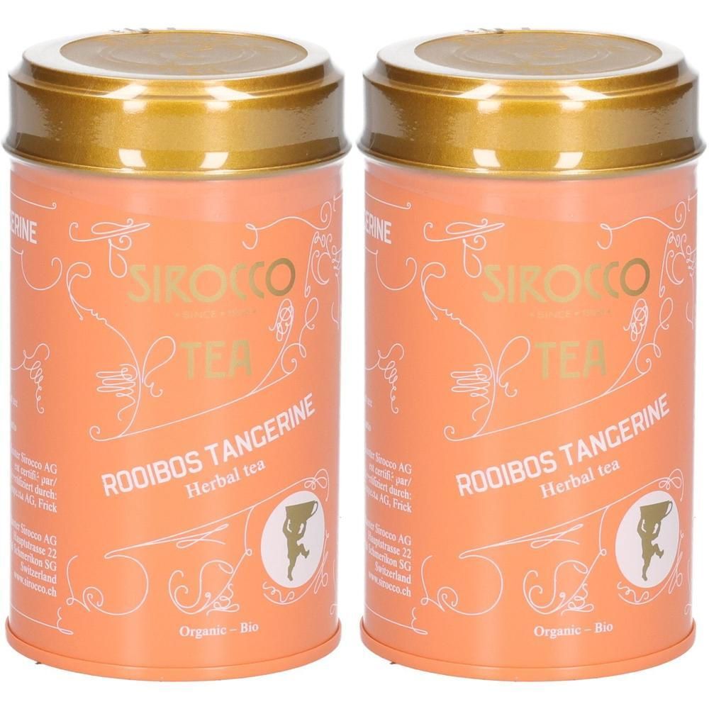 Zwei Dosen Sirocco Rooibos Tangerine Tee. Orangefarbene Dosen mit goldenen Deckeln, weißer Schrift und Ornamenten.