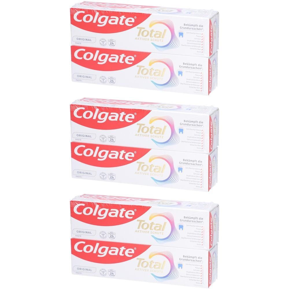Drei Packungen Colgate Total Zahnpasta.