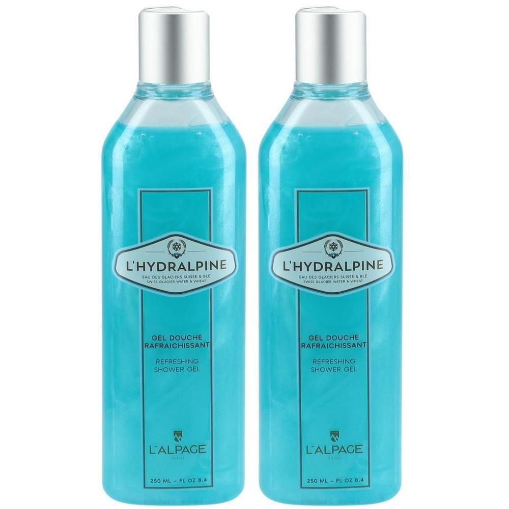 Zwei Flaschen L'Hydralpine Duschgel, 250 ml. Hellblaue Flüssigkeit mit Glitzer. Silberne Verschlüsse.