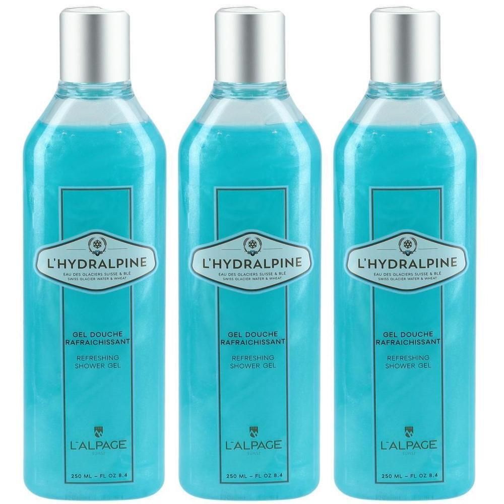 Drei Flaschen erfrischendes Duschgel von L'Hydralpine. Die durchsichtigen Flaschen enthalten blaues, schimmerndes Gel und haben silberne Verschlüsse.