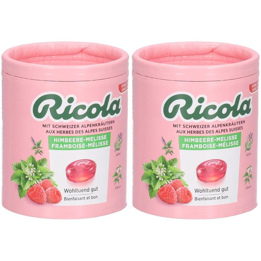 Zwei Dosen Ricola Himbeer-Melisse Bonbons mit Schweizer Alpenkräutern.