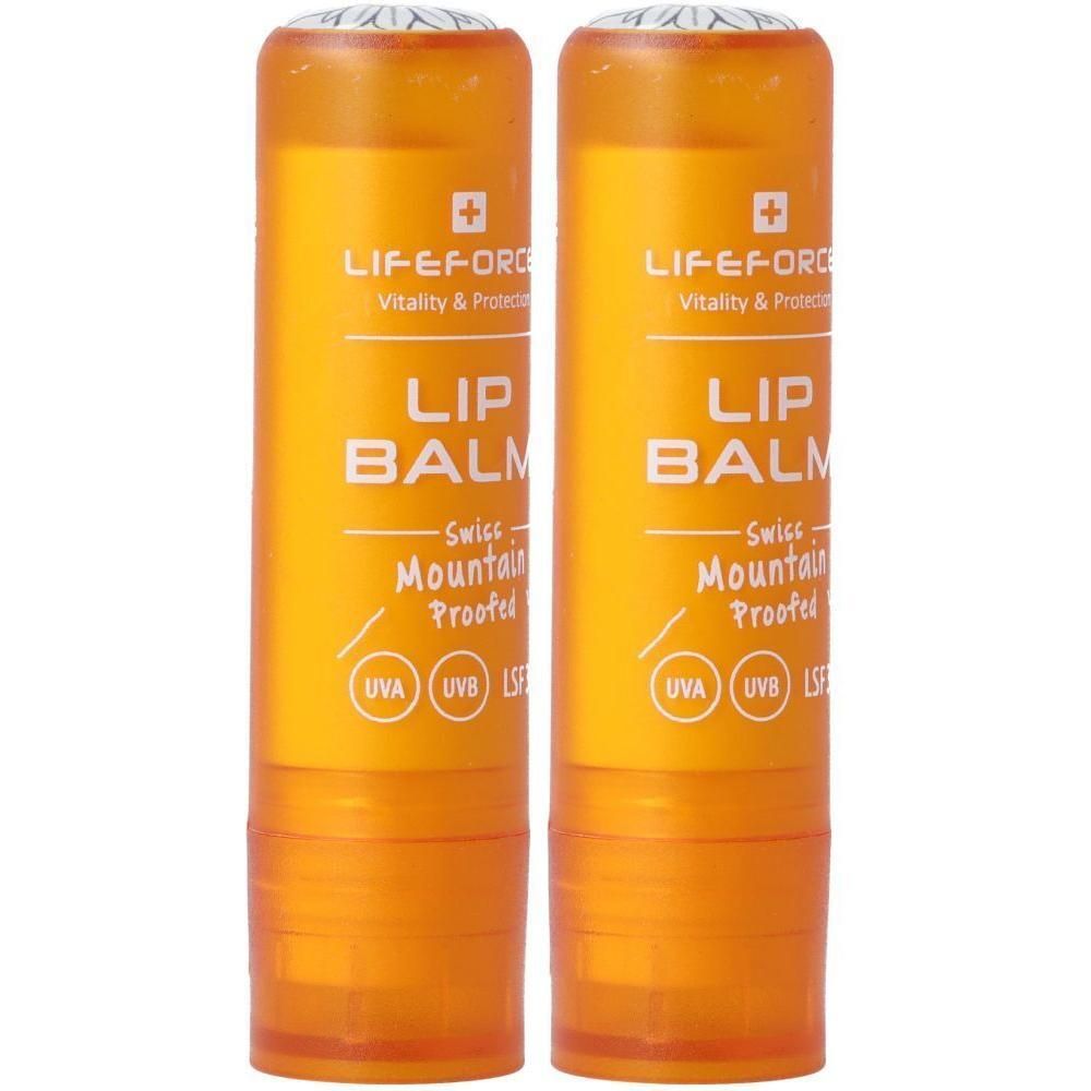 Zwei orangefarbene Lippenbalsamtuben mit weißer Schrift, die "LIP BALM" und "Swiss Mountain Proofed" angibt.