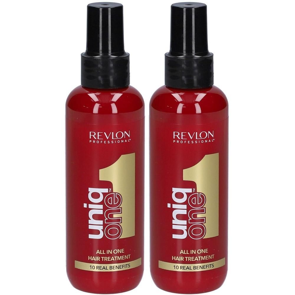 Zwei rote Flaschen Revlon Uniq One All In One Hair Treatment mit schwarzem Sprühkopf.