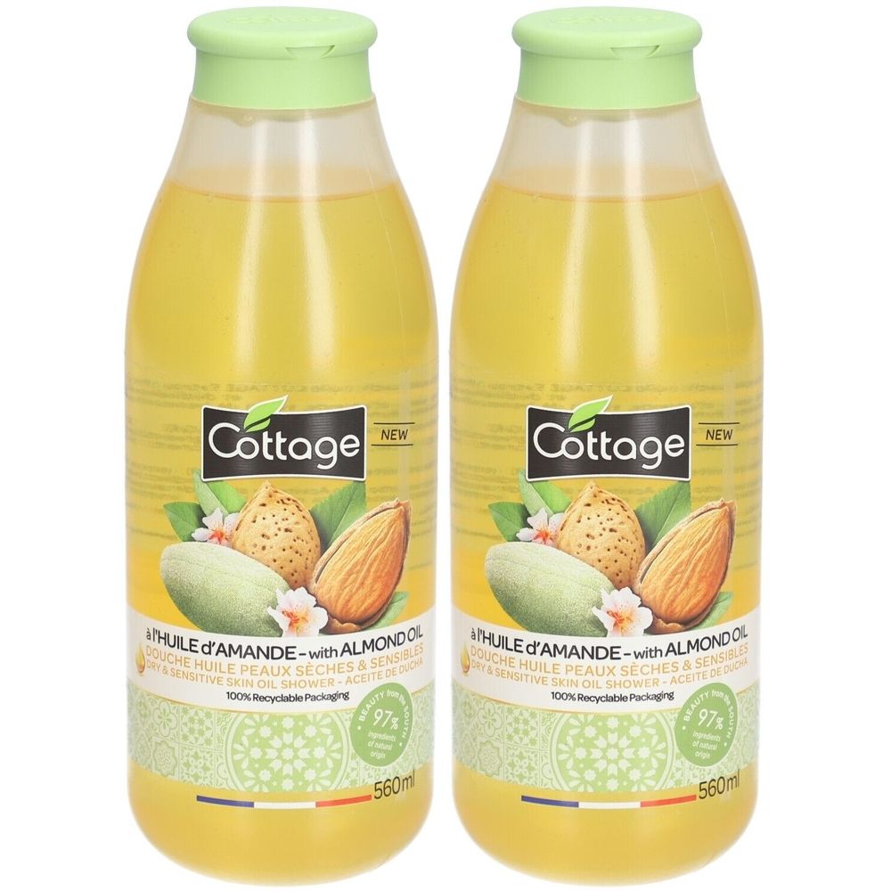 Deux flacons de douche à l'huile. Liquide jaune, bouchons verts. Inscription: Cottage, huile d'amande. 97% recyclable, 560ml.