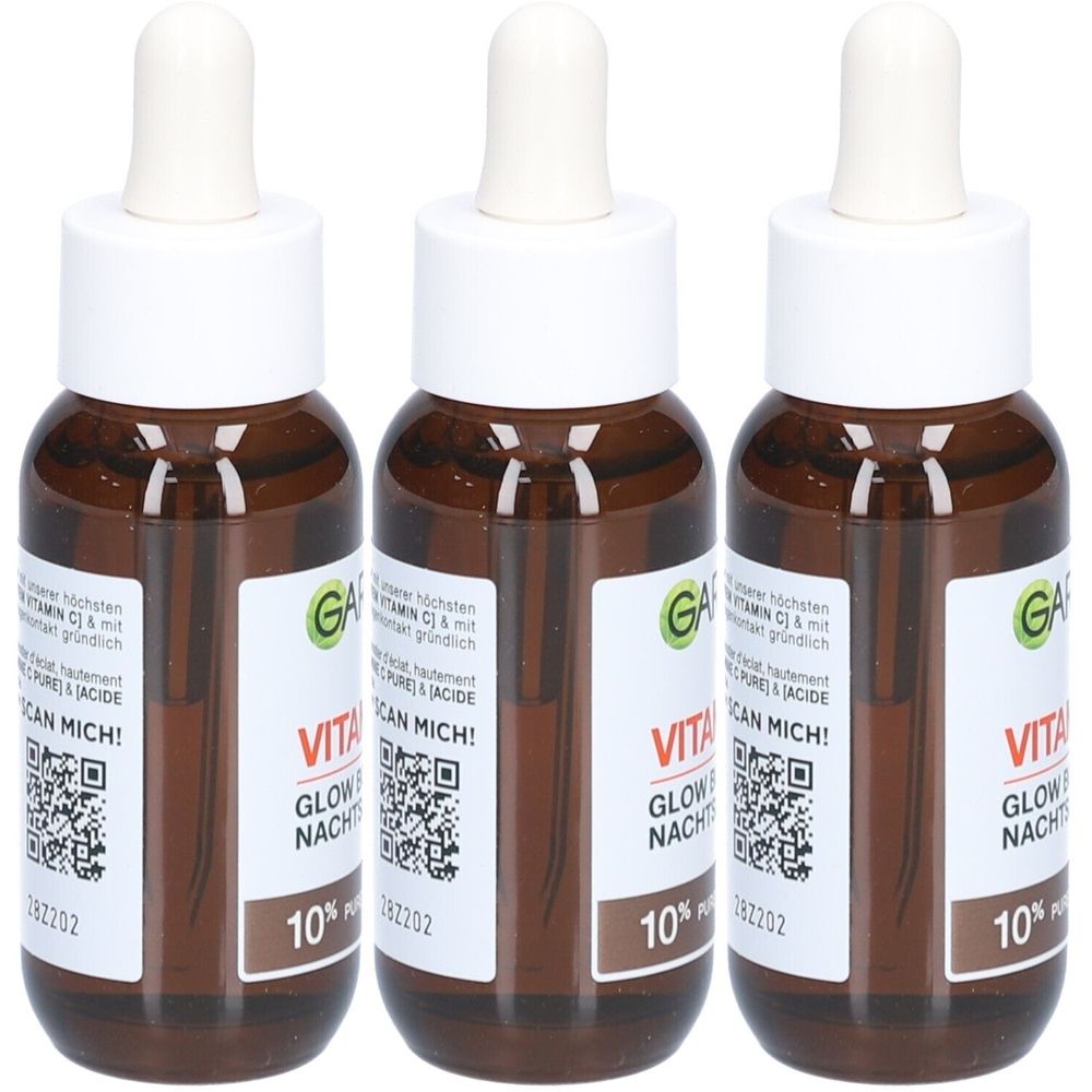 Trois flacons bruns avec des bouchons blancs et des pipettes. Les étiquettes indiquent "VITA GLOW NACHT" et "10% Pure".