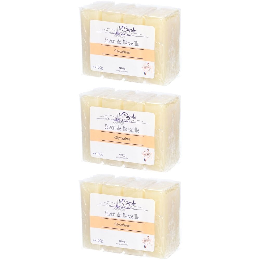 Drei Blöcke Seife, verpackt. Aufschrift: Savon de Marseille, Glycérine, 99%. Marke: La Cigale.