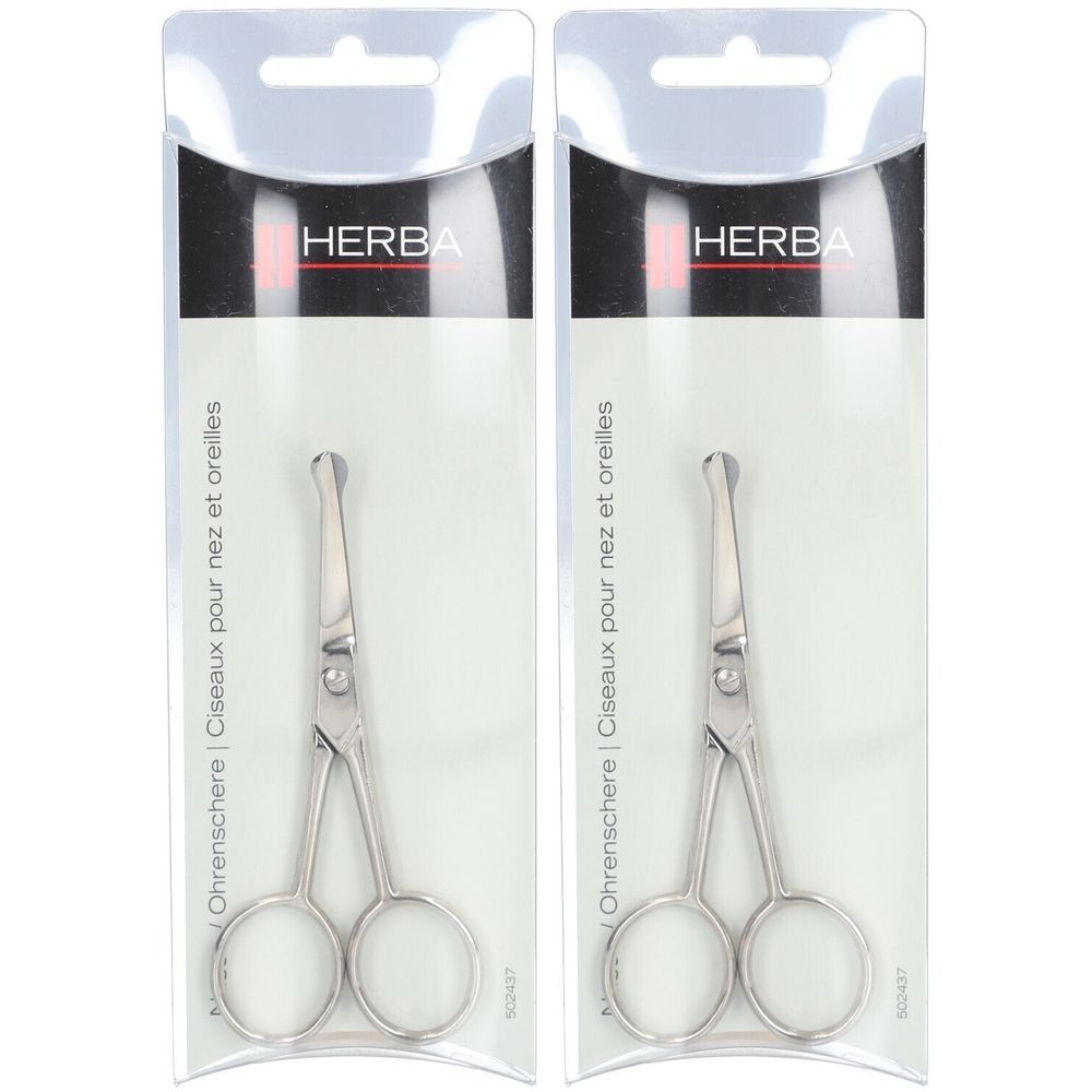 Zwei vernickelte Nasen- und Ohrenscheren in Plastikverpackung. Marke HERBA. Aufschrift: Ohrenschere | Ciseaux pour nez et oreilles.