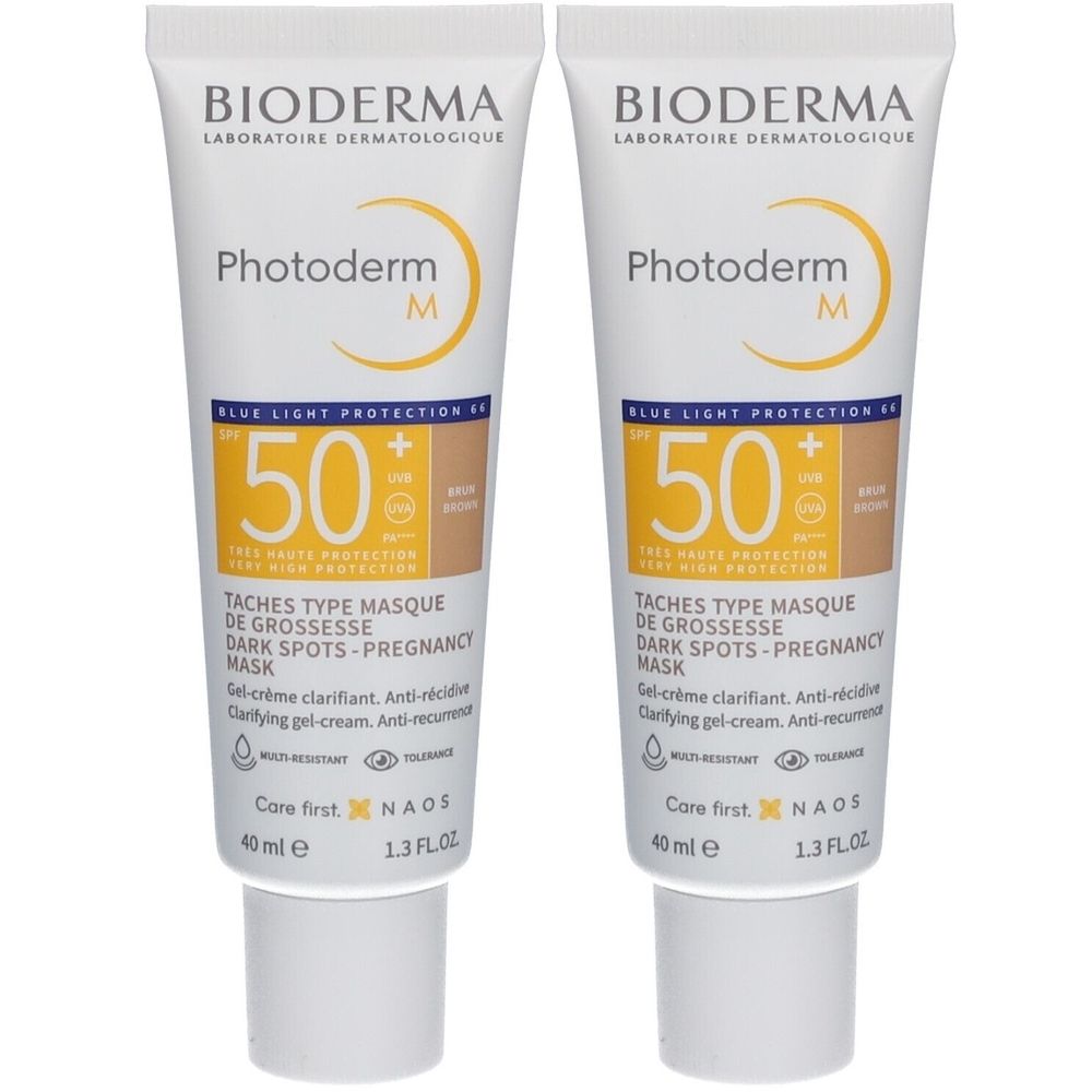 Zwei Tuben Bioderma Photoderm M. Weiße Tuben mit gelben und braunen Akzenten. Aufschrift: SPF 50+, Dark Spots-Pregnancy Mask.