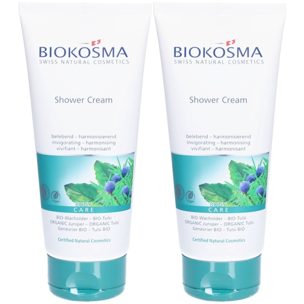 Deux tubes de crème de douche. Blanc, avec des accents turquoise et des informations sur le produit. Marque : Biokosma. Inscription : Shower Cream, BIO-Wacholder & BIO-Tulsi.
