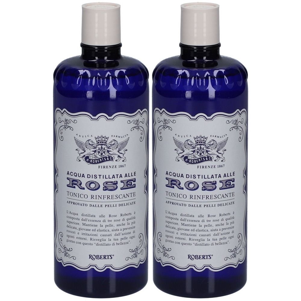 Zwei blaue Flaschen mit weißem Etikett und Aufschrift. Der Text lautet: ACQUA DISTILLATA ALLE ROSE TONICO RINFRESCANTE. Marke: ROBERTS.