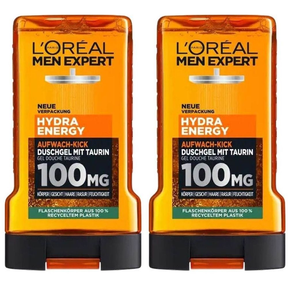 Deux flacons de gel douche L'Oréal Men Expert Hydra Energy. Liquide orange, bouchon noir, texte et logo.