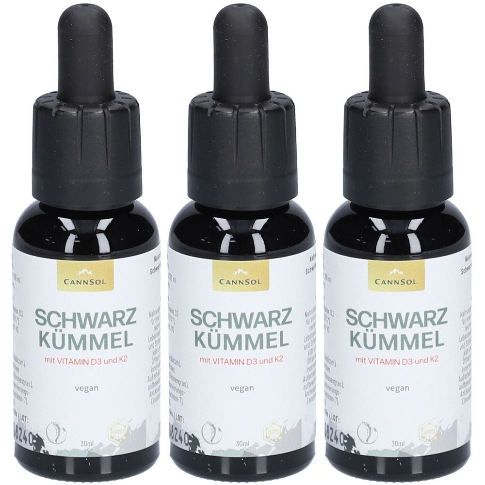 Trois flacons de CANNSOL Schwarzkümmel avec vitamine D3 et K2. Flacons en verre noir avec compte-gouttes noir.
