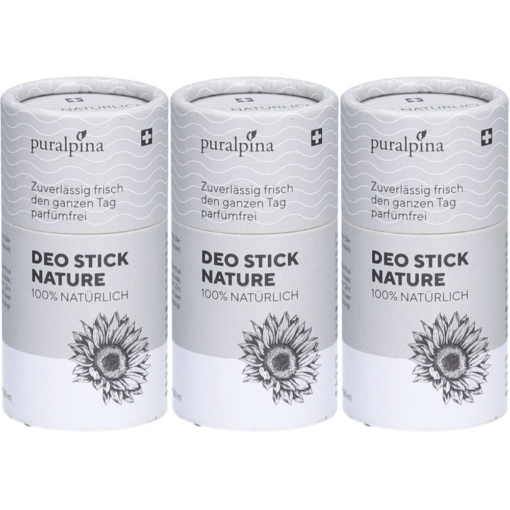Trois déodorants en bâton cylindriques. Emballage blanc avec texte: puralpina, DEO STICK NATURE, 100% NATÜRLICH. Image d'un tournesol.