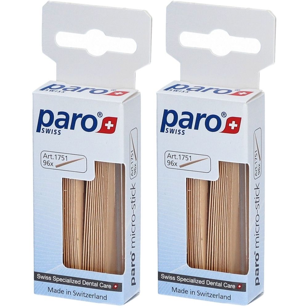 Deux boîtes de cure-dents paro micro-stick. Emballage blanc avec logo, croix suisse et informations produit. 96 pièces par boîte.
